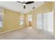 Spacious bedroom with carpet, ceiling fan, and natural light coming through the windows at 2703 Gullane Ct, Kissimmee, FL 34746