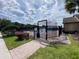 Gated community pool area, featuring a brick paver walkway and lush landscaping at 2703 Gullane Ct, Kissimmee, FL 34746