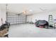 Spacious garage with epoxy flooring and ample room for parking and storage at 2703 Gullane Ct, Kissimmee, FL 34746