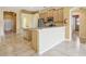 Open kitchen featuring stainless steel appliances, island with bar seating, and easy access to other rooms at 2703 Gullane Ct, Kissimmee, FL 34746