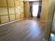A spacious living room with new wood flooring, large window and nice natural light at 2703 Gullane Ct, Kissimmee, FL 34746