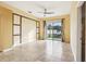 Bright living area with tile flooring, ceiling fan, and sliding glass doors to the outdoor space at 2703 Gullane Ct, Kissimmee, FL 34746