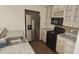 Bright kitchen featuring stainless steel refrigerator and elegant granite countertops at 6016 Westgate Dr # 301, Orlando, FL 32835