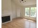 Comfortable living room featuring fireplace, wood floors and natural light at 6016 Westgate Dr # 301, Orlando, FL 32835