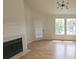 Inviting living room with a cozy fireplace, wood floors, and bright natural light at 6016 Westgate Dr # 301, Orlando, FL 32835