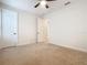 Well-lit bedroom with two closets and ceiling fan at 676 Villa Park Rd, Kissimmee, FL 34759