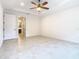 Spacious bedroom with tile floors and ceiling fan at 676 Villa Park Rd, Kissimmee, FL 34759