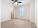 Charming bedroom with window, ceiling fan and carpet at 676 Villa Park Rd, Kissimmee, FL 34759