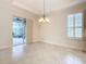 Spacious dining area with large window and patio access at 676 Villa Park Rd, Kissimmee, FL 34759