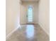 Bright entryway with tile flooring and elegant glass door at 676 Villa Park Rd, Kissimmee, FL 34759