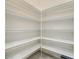 Large walk-in pantry with ample shelving at 676 Villa Park Rd, Kissimmee, FL 34759