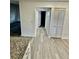 Hallway with wood-look floors and access to other rooms at 2031 Balboa Way, Kissimmee, FL 34741