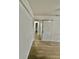 Hallway with sliding barn door and wood-look flooring at 2031 Balboa Way, Kissimmee, FL 34741