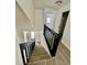 Modern staircase with dark wood railings leading to the second floor at 2031 Balboa Way, Kissimmee, FL 34741