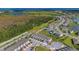 An aerial view showing the community's layout amidst lush greenery and water features at 3359 Bellezza Ct, Kissimmee, FL 34746