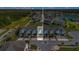 Aerial view of a townhome community in a lush setting, with nearby water features at 3359 Bellezza Ct, Kissimmee, FL 34746