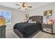 Bedroom featuring carpet flooring, a window, and a ceiling fan at 3359 Bellezza Ct, Kissimmee, FL 34746