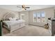 Spacious main bedroom with carpet flooring, multiple windows and a large bed at 3359 Bellezza Ct, Kissimmee, FL 34746