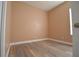 Neutral bedroom with light wood-look floors and window at 2221 The Oaks Blvd, Kissimmee, FL 34746
