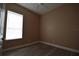 Light-filled bedroom featuring wood-look floors and bright window at 2221 The Oaks Blvd, Kissimmee, FL 34746