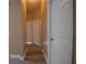 Hallway with wood-look floors and multiple entrances at 2221 The Oaks Blvd, Kissimmee, FL 34746