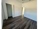 Bedroom with wood-look floors, with a walk-in closet at 5115 Old Highway 37, Lakeland, FL 33811