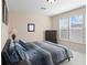 Cozy bedroom features neutral walls, carpet, and a window providing natural light, dresser, and a queen size bed at 1387 Lexington Ave, Davenport, FL 33837