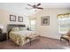 Bedroom featuring a ceiling fan, carpet floors, and neutral wall colors at 1387 Lexington Ave, Davenport, FL 33837