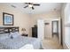 Bedroom includes a queen size bed with an adjacent doorway to the restroom at 1387 Lexington Ave, Davenport, FL 33837