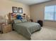 Bedroom featuring a neutral color scheme, carpeted floors, and natural light, creating a serene retreat at 1387 Lexington Ave, Davenport, FL 33837