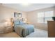 Bedroom with soft lighting, bedside tables, a window, and carpeted flooring at 1387 Lexington Ave, Davenport, FL 33837