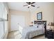 Cozy bedroom with neutral walls, carpet flooring, ceiling fan, and double door closet at 1387 Lexington Ave, Davenport, FL 33837