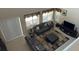 A bird's eye view of the staged living room featuring tile floors and modern furniture at 1387 Lexington Ave, Davenport, FL 33837