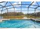 Pool and hot tub area featuring clear water and covered screening at 1387 Lexington Ave, Davenport, FL 33837