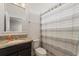 Small bathroom with granite countertop and shower at 507 Natural Bridge Ct, Apopka, FL 32703