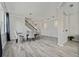 Bright dining room with tile floors, chandelier, and seating for four at 507 Natural Bridge Ct, Apopka, FL 32703