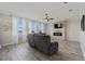 Living room with fireplace, large windows, and view of lake at 507 Natural Bridge Ct, Apopka, FL 32703