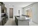 Kitchen with an island with granite countertops and stainless appliances at 13712 Summerport Village Pkwy, Windermere, FL 34786