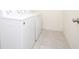 Bright laundry room with white washer and dryer at 13712 Summerport Village Pkwy, Windermere, FL 34786