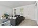 Bright living room with tile flooring, neutral paint, and comfortable seating at 13712 Summerport Village Pkwy, Windermere, FL 34786