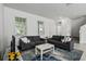 Open-concept living space with two sofas, a modern rug and an abundance of natural light at 13712 Summerport Village Pkwy, Windermere, FL 34786