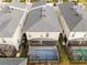 Aerial view of a home with a screened-in pool and patio in a residential neighborhood at 4348 Quote St, Kissimmee, FL 34746