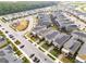 Community aerial view showcasing modern homes, landscaping, a playground, and convenient parking at 4348 Quote St, Kissimmee, FL 34746