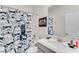 Bathroom featuring a shower with a Storm Trooper curtain, toilet, sink with vanity, and wall art at 4348 Quote St, Kissimmee, FL 34746
