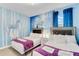 Themed bedroom showcasing two twin beds, themed wallpaper, and soft carpet at 4348 Quote St, Kissimmee, FL 34746