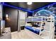 Themed ' bedroom featuring a bunk bed, themed wallpaper, and carpet flooring at 4348 Quote St, Kissimmee, FL 34746
