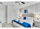 Bright bedroom featuring a ceiling fan, closet, dresser and a comfortable bed at 4348 Quote St, Kissimmee, FL 34746