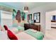 Fun, themed bedroom with two twin beds, pirate wall decor, and a treasure chest style dresser at 4348 Quote St, Kissimmee, FL 34746
