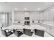 Bright kitchen features an oversized center island with seating, modern appliances, and ample cabinetry at 4348 Quote St, Kissimmee, FL 34746
