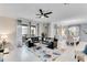 Open-concept living room featuring tile floors, modern decor, and sliding glass doors to patio at 4348 Quote St, Kissimmee, FL 34746